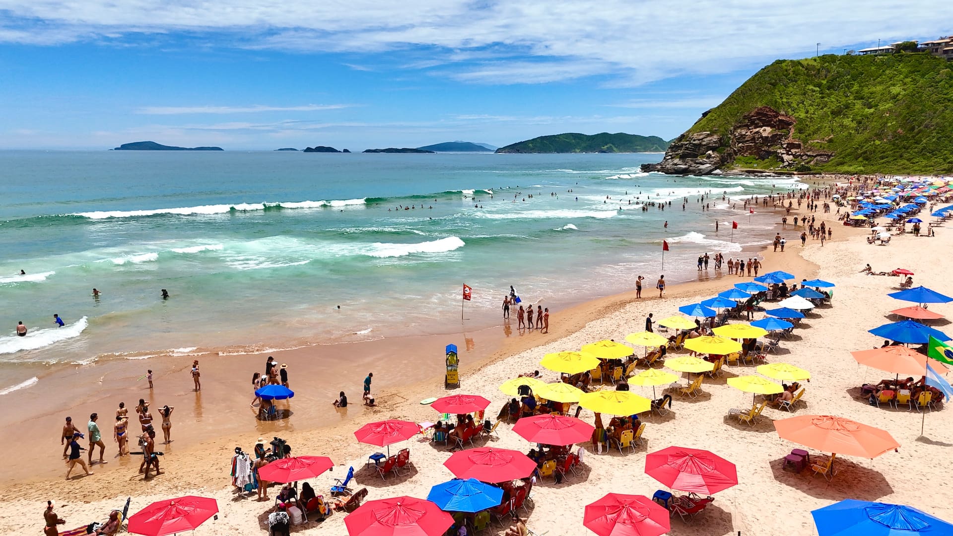 Geribá beach with colorful umbrellas and surf